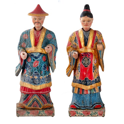 A large pair of North-Italian polychrome-painted papier-machê decorated Magots, a mandarin official and his consort, with tilting heads with lead weights.